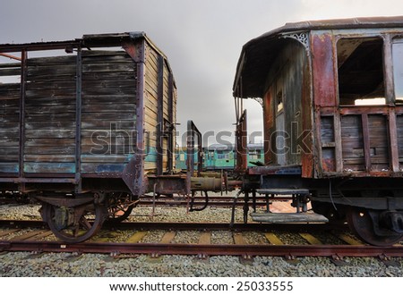 Abandoned railroad carriages standing on rusty rails (an HDR image)