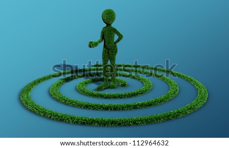 green grass man inside a grass spiral isolated on blue background