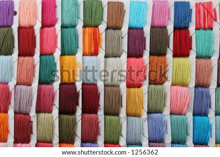 Group of Embroidery thread cards lined up in a grid showing random colors