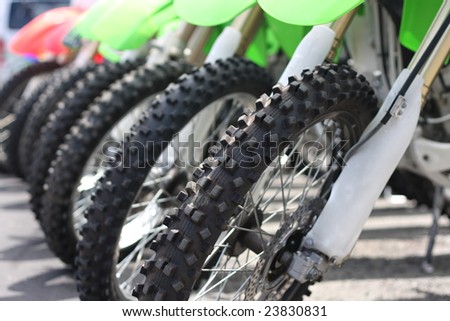 The front tires of off road motorbikes waiting  to be ridden.