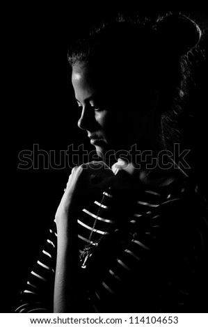 sadness girl on black background, black and white image