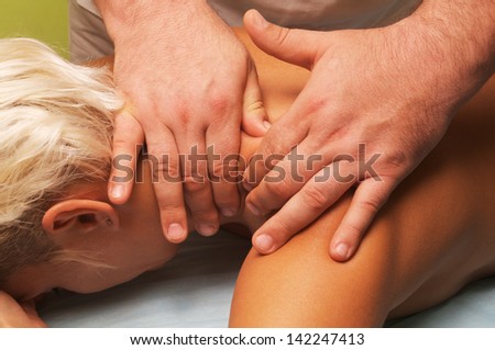 position of hands and fingers at massage of a female body