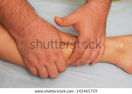 position of hands and fingers at  lymphatic drainage massage of a female body