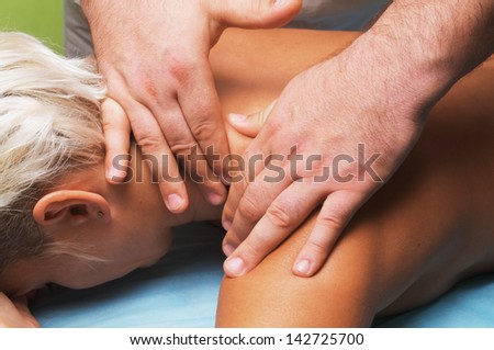 position of hands and fingers at massage of a female body