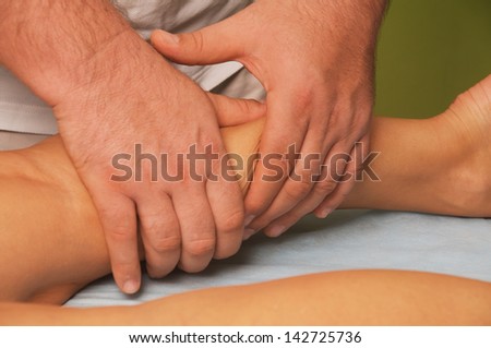 position of hands and fingers at lymphatic drainage massage of a female body