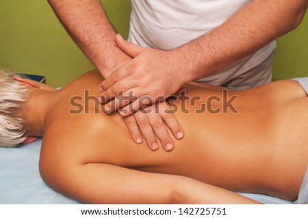 position of hands and fingers at lymphatic drainage massage of a female body