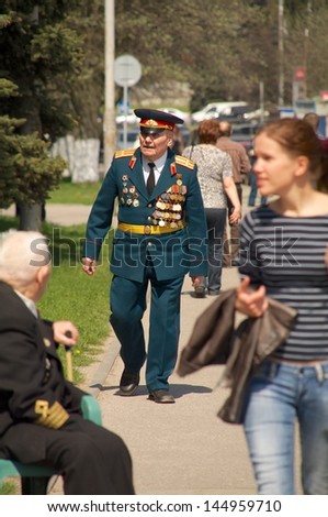 KALININGRAD, RUSSIA - MAY 07: veteran of the World War II with his medals walked at street on during the victory celebration in World War II on May 07, 2013 in Kaliningrad, Russia