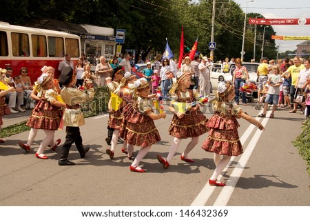 KALININGRAD, RUSSIA - JULY 14: children in russian national dress sang and danced on the street on City Day of Kaliningrad celebration on July 14, 2013 in Kaliningrad, Russia