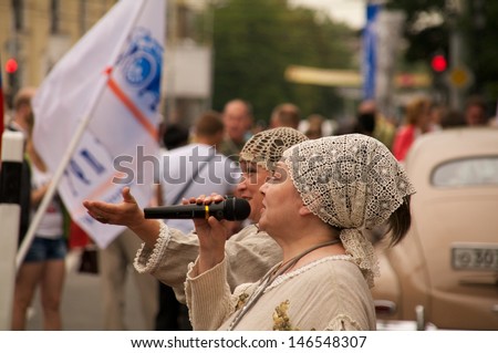 KALININGRAD, RUSSIA - JULY 14: women in russian national dress sang and danced on the street on City Day of Kaliningrad celebration on July 14, 2013 in Kaliningrad, Russia