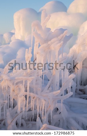 ice mountains with icicles at sunset light
