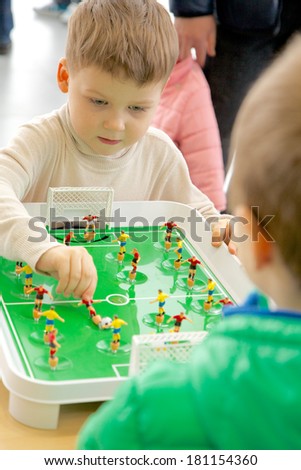KALININGRAD, RUSSIA - MARCH 02, 2014: Boys plays in football table game in camp