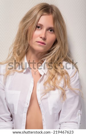 pensive sad pretty girl with open blouse
