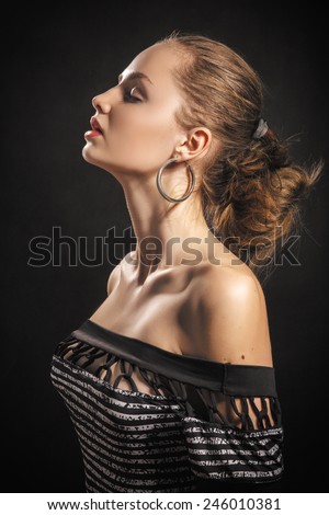 pretty aroused young woman profile on black background