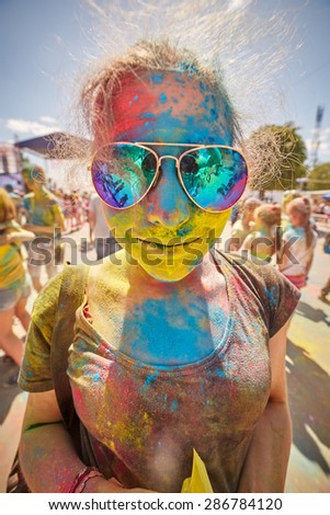 KALININGRAD, RUSSIA - JUNE 12, 2015: People with painted faces during the Holi Festival of Colors. Holi is a festival celebrated as a festival of colours