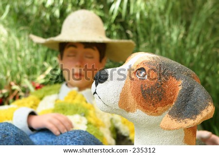Boy and dog in flower display garden at the Bellagio Hotel, Las Vegas