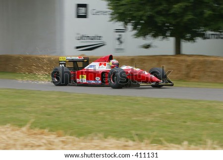 Vintage Formula 1 Ferrari Racing Car generating sparks at Goodwood Festival of Speed 2005