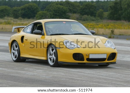 stock photo Yellow Porsche sportscar Save to a lightbox Please Login
