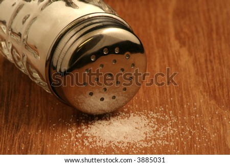 Spilt salt and salt shaker