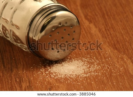 Spilt salt and salt shaker