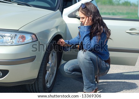 attractive woman with mobile phone and car