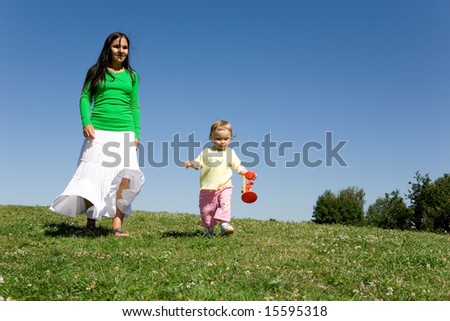 active family on green meadow