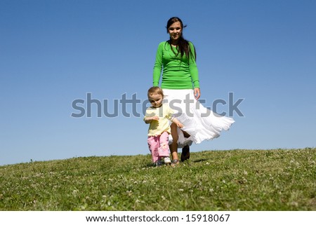 active family on green meadow
