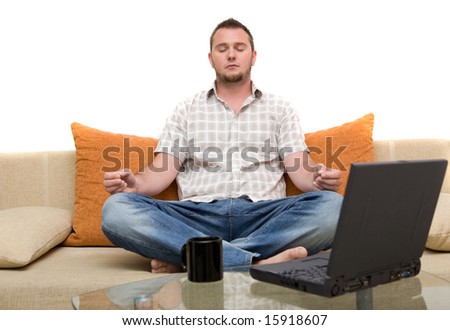 happy man sitting on sofa with laptop
