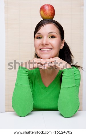 attractive brunette woman holding apple