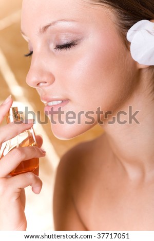 young beautiful woman with perfume