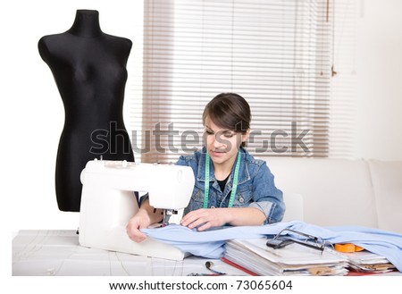 young adult fashion designer at work