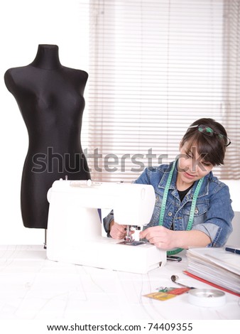 young adult fashion designer at work