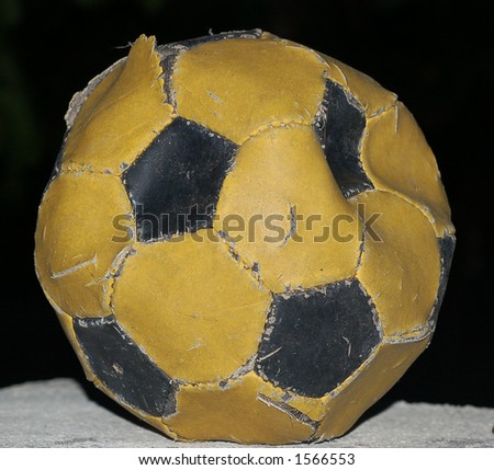 worn-out football at the end of the rood ready to been thrown away
