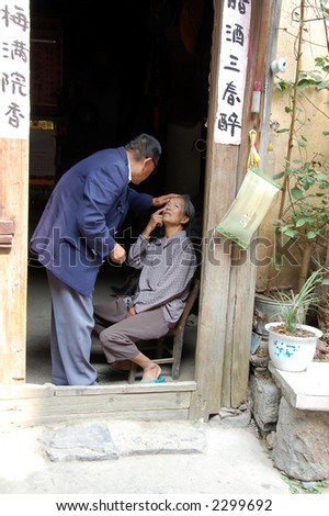 caring chinese older couple showing loving gesture