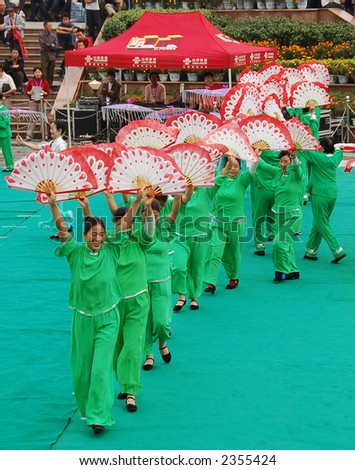 elderly chinese ladies performing traditinal fan dance