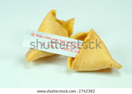 fortune cookies being breaking off revealing paper of good words