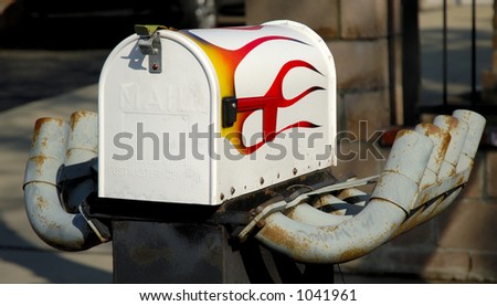 Mailbox with painted flames and exhaust pipes. Concept, fast, speed, speedy postal service.