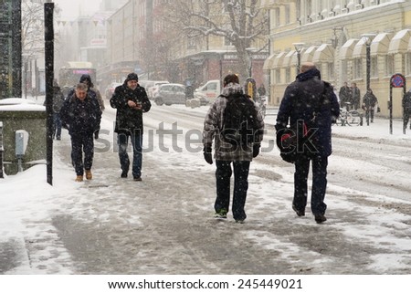Vasteras, Sweden - January 12: People struggling to move forward in the snowstorm on January 12, 2015 in Vasteras, Sweden.