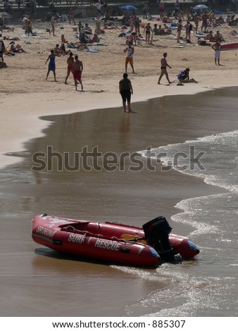 Surf rescue boat on a crowded beach