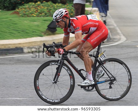 KUANTAN - MARCH 1: Floris Goesinnen from Drapac Cycling speeding after last corner during Stage 7 of the le Tour de Langkawi from Bentong to Kuantan on March 1, 2012 in Kuantan, Pahang, Malaysia.