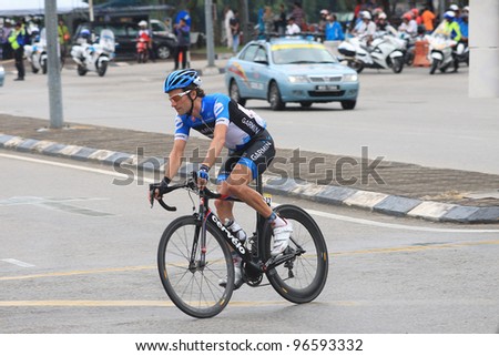 KUANTAN - MARCH 1: David Zabriskie (Garmin Barracuda) take last corner during Stage 7 of the le Tour de Langkawi from Bentong to Kuantan on March 1, 2012 in Kuantan, Pahang, Malaysia.