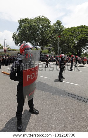 KUALA LUMPUR, MALAYSIA - APRIL 28: Riot police at the protest rally organized by the coalition for clean and fair election in Dataran Merdeka on April 28, 2012 in Jln Parlimen, Kuala Lumpur, Malaysia.