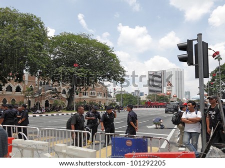 KUALA LUMPUR, MALAYSIA - APRIL 28: Policeman sentry at the protest rally organized by the coalition for clean and fair election on April 28, 2012 in Dataran Merdeka, Kuala Lumpur, Malaysia.