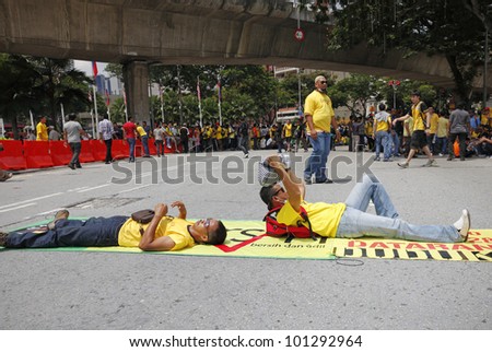 KUALA LUMPUR, MALAYSIA - APRIL 28: Defiant protester at the street rally organized by the coalition for clean and fair election on April 28, 2012 in Dataran Merdeka, Kuala Lumpur, Malaysia.