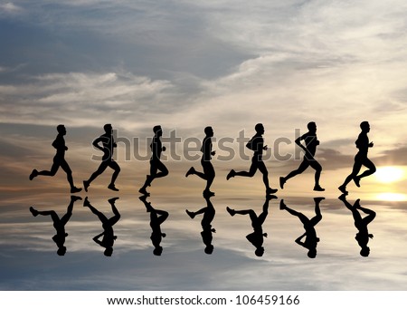 Silhouette of runner with reflection during a surreal dramatic sunset.