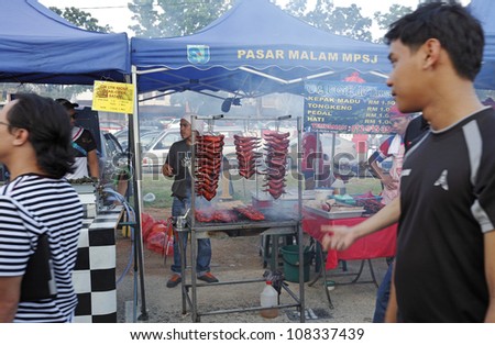 SUBANG JAYA, MALAYSIA - JULY 22: Food vendor at a Ramadan food bazaar on July 22, 2012 in Subang Jaya, Malaysia. The food bazaar is establish for muslim to break fast during the holy month of Ramadan.