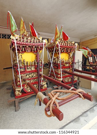 AMPANG, MALAYSIA - OCTOBER 15: Ornate sedan chair at the Nine Emperor God Temple on October 15, 2012 in Ampang, Malaysia. Taoist devotees ferry their gods to the temple on the chair.