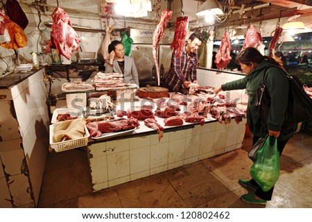 SUZHOU, CHINA - NOV 8: Dog meat for sale in a wet market on Nov 8, 2012 in Suzhou, China. Dog meat is believed to have medicinal property and is used for treating rheumatism in China.