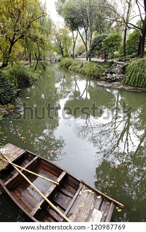 SUZHOU, CHINA - NOV 9: A water canal in the Humble Administrator\'s Garden on November 9, 2012 in Suzhou, China. The classical garden is a UNESCO World Heritage site.