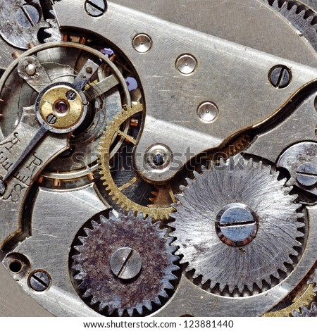 Macro image of a metallic mechanical watch component.