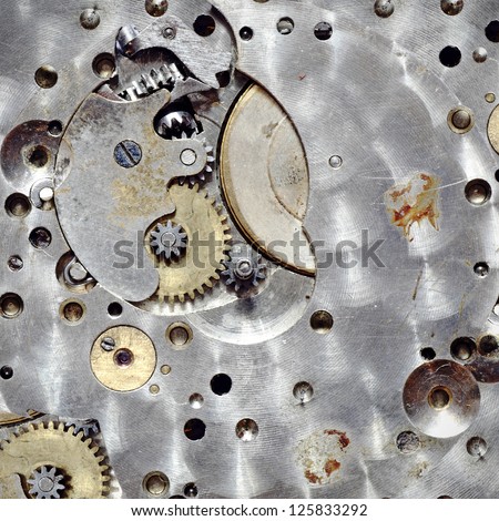 Macro image of a metallic mechanical watch component.